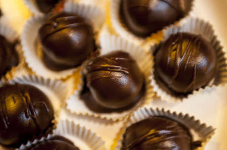 Plate full of chocolate truffles in paper cups