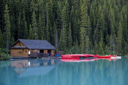 Boathouse and red canoes, Banff National Park, Canadaの写真素材