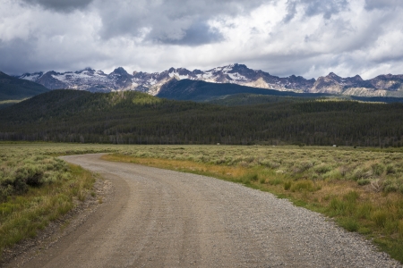View of a gravel road near the Sawtooth Mountain Range in Idahoの写真素材