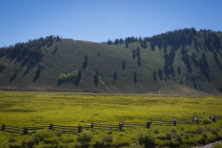 Open range land, hills and blue sky in Idahoの写真素材