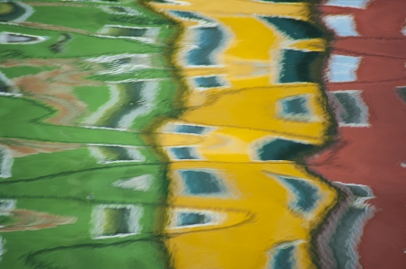 Reflections in a canal of colorful houses, Burano, Italy, near Veniceの写真素材