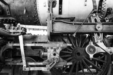 Black-and-white close-up of locomotive wheels and engineの写真素材