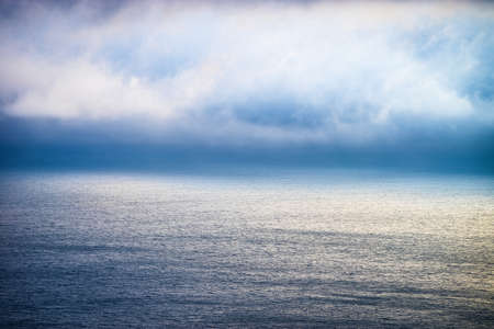 Beautiful fog bank above the ocean at Big Sur, Californiaの写真素材