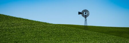 Landscape with the windmill and wheat fields in Eastern Washington stateの写真素材