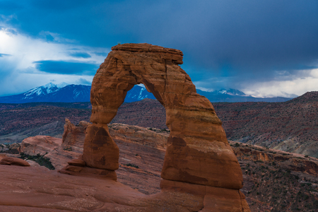 Delicate arch in Utah's Arches national Park, beneath a stormy skyの写真素材