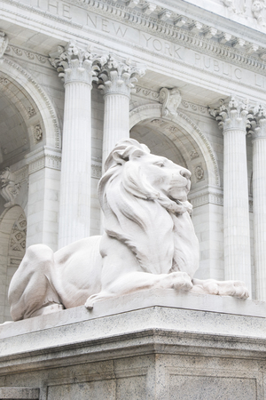 Marble statue of lion at entrance to New York City public libraryの写真素材