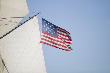 Post Revolutionary War 15 Star American Flag, circa 1795 being flown from a vintage sailing ship of the timeの写真素材