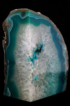Emerald and clear crystal rock on an isolated black background