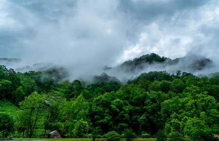 A rainy day in Chimney Rock makes the clouds hang low over the mountain tops.の写真素材