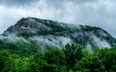 A rainy day in Chimney Rock makes the clouds hang low over the mountain tops.の写真素材