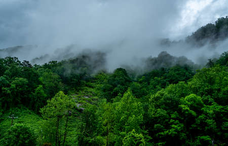 A rainy day in Chimney Rock makes the clouds hang low over the mountain tops.の写真素材