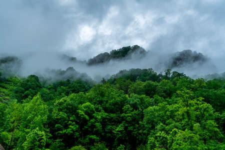 A rainy day in Chimney Rock makes the clouds hang low over the mountain tops.の写真素材
