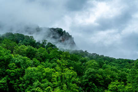 A rainy day in Chimney Rock makes the clouds hang low over the mountain tops.の写真素材