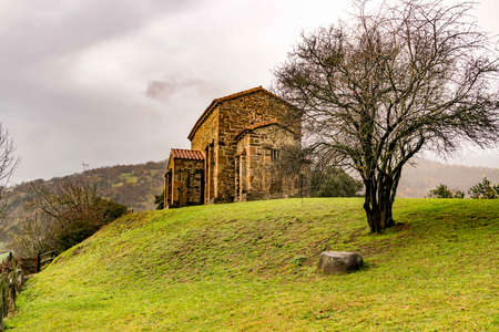 St Christine of Lena is a Pre Romanesque church in the province of Asturias Spain with beautiful mountains and valleys all around.の写真素材