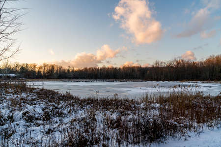 A tranquil sunset in the park on a cold winters day in Northeast Ohio.の写真素材