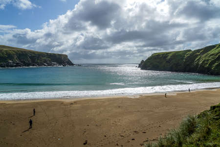 A beautiful crescent shaped beach in Glencolmkille Ireland.の写真素材