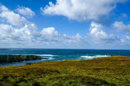 The landscape of Glencolmkille Ireland rolling hills and beautiful meadows.の写真素材