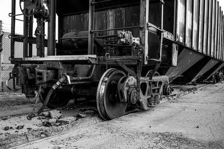 A small train and train cars sitting outside of the salt mines on Lake Erie in Northeast Ohio.の写真素材