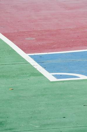 Old basketball court with a blue color floor.の写真素材
