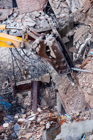An excavator working at demolition siteの写真素材