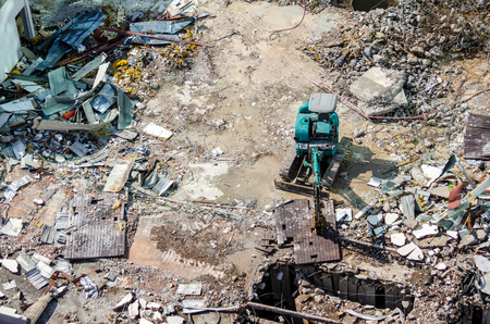 An excavator working at demolition siteの写真素材