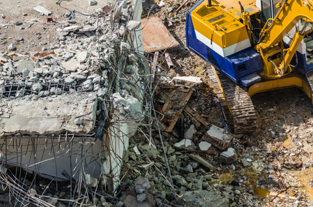 An excavator working at demolition siteの写真素材