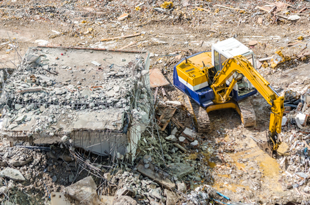 An excavator working at demolition siteの写真素材