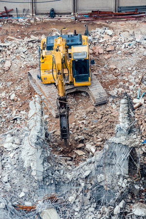 An excavator working at demolition siteの写真素材