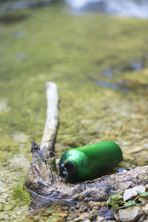 Bottle water on river mountain, trekking, Italyの写真素材