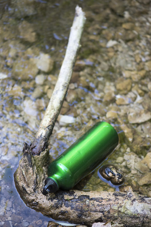 Bottle water on river mountain, trekking, Italyの写真素材