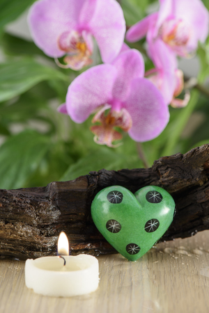 Spa Still Life, Love Stones and wood on green backgroundの写真素材