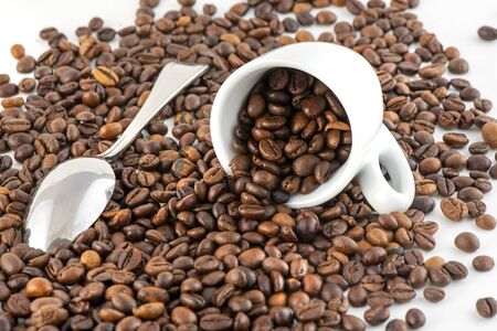 Cup of Coffee Beans Isolated on White Background, close-upの写真素材