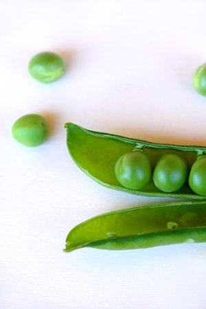 Green Peas fresh vegetable isolated on white backgroundの写真素材