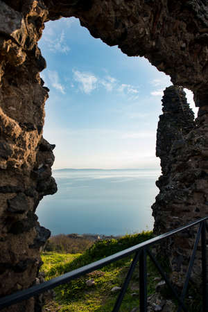 Lake in winter with calm water from natural windowの写真素材