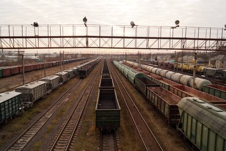 Cargo trains on  freight railroad station - industrial landscape