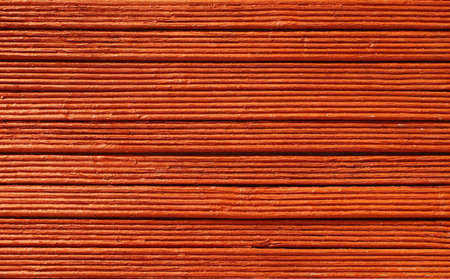Wooden bars, painted in red. Wooden red trims background.の写真素材