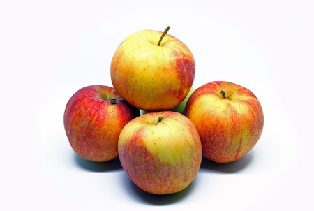 Several apples folded by a slide, on a white background.の写真素材