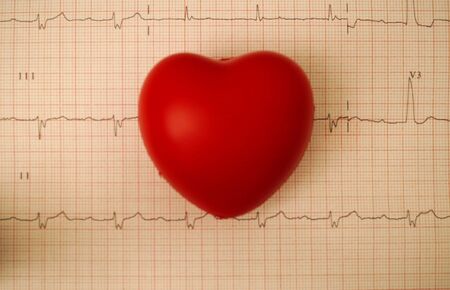 Red heart on ECG results. Cardiology concept.の写真素材