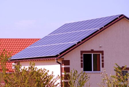 Solar panels on the roof of house. Environmental free electric power.