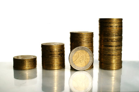 Columns of coins with euro coin, copy space. Financial success, profit concept.