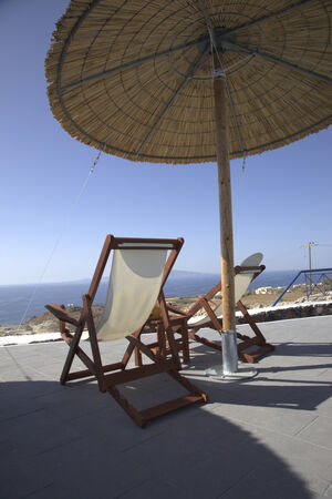 Seats near swimming pool の写真素材
