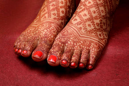 Ledy Feet and Hands in Heena for wedding in white background and isolated hand and feet | hand design | feet design | beautiful design | nice designの写真素材
