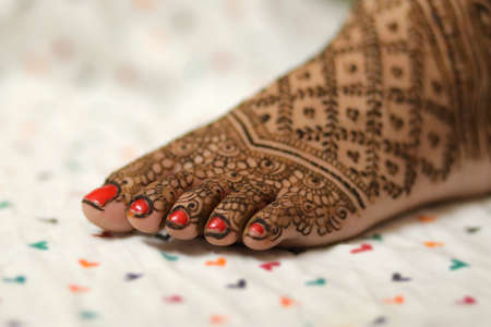 Ledy Feet and Hands in Heena for wedding in white background and isolated hand and feet | hand design | feet design | beautiful design | nice designの写真素材