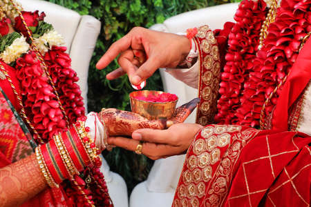 indian wedding fill story with bridal and groom start to end with fashion  tasty food, jewellery  decoration  saptapadi samayu javtal ganesh Puja beautiful background all wedding rituals sindurの写真素材