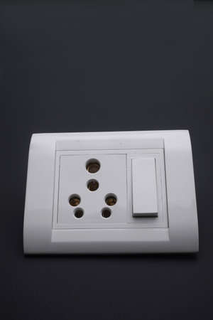wall switch power electronic component socket different and modern realistic part | wall switch modular and plate in grey backgroundの写真素材