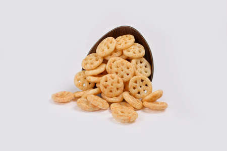Fried and Spicy wheel Snacks or Fryums (Snacks Pellets) served in a bowl. selective focus - Image