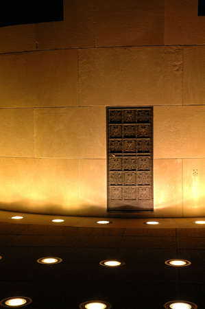 Metal door built into the side of a concrete structure.の写真素材