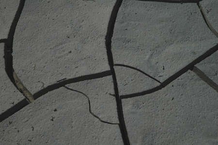Dry conditions in the western united states have dried many bodies of water leaving unique patterns in the mud.の写真素材
