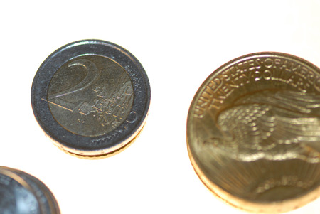 The Euro stacked against the gold standard coin.