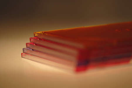 An image of a stack of colored CD-Rom holders with limited depth of view.